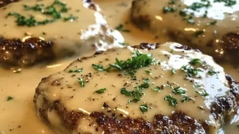 Delicious Amish Hamburger Steak Bake served in a ceramic dish