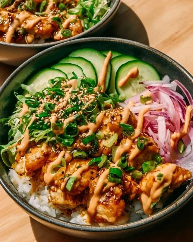 Delicious Bang Bang Chicken Bowl with vibrant vegetables and spicy sauce
