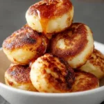 Delicious breakfast pancake poppers served on a plate with syrup