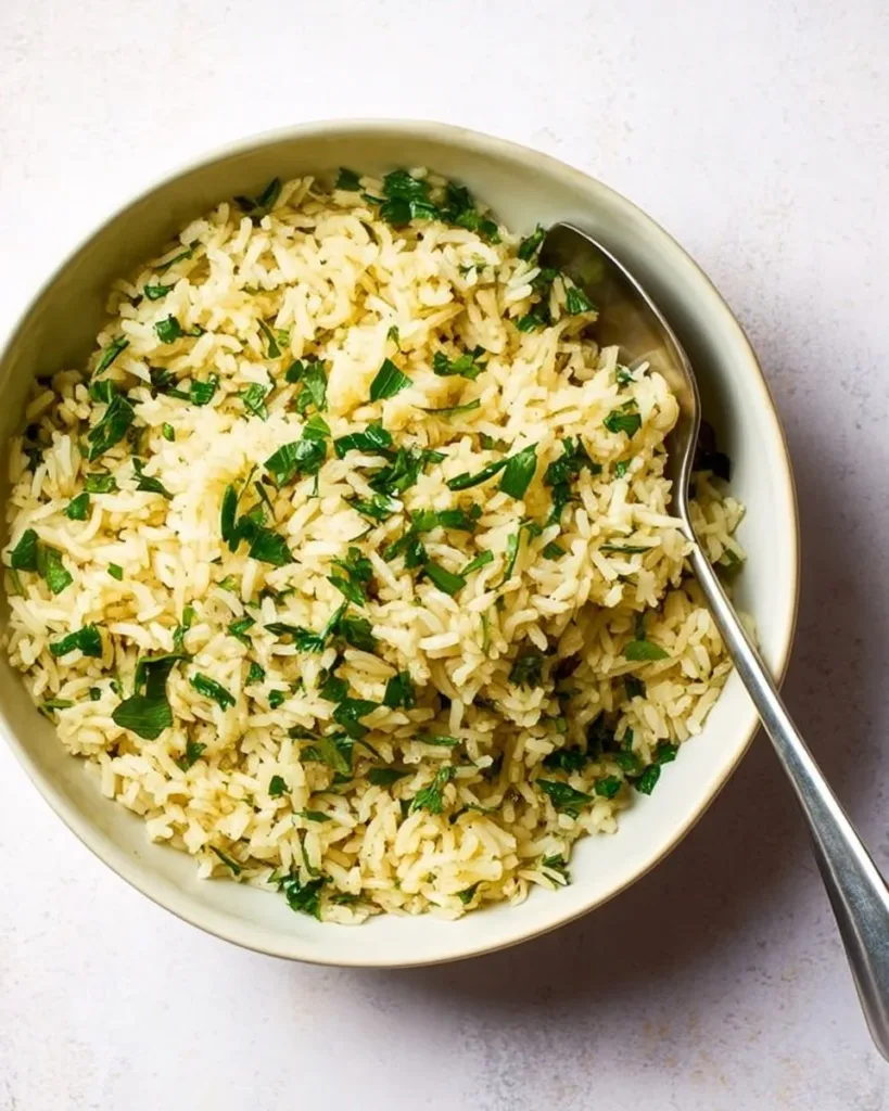 Homemade rice pilaf served in a bowl with herbs and spices