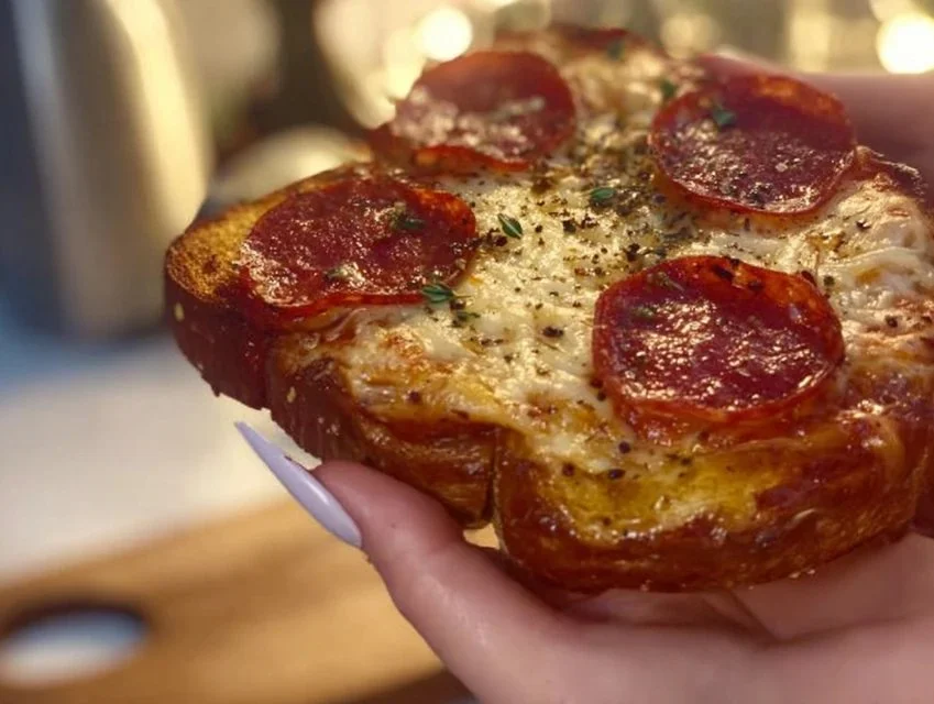 Delicious pizza toast topped with cheese and toppings